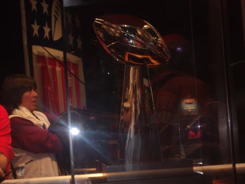 1973 Ford Torino - A trophy is displayed behind glass, with a person visible in the foreground.