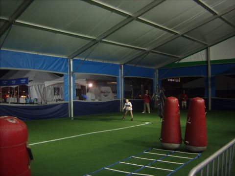 1973 Ford Torino - People are playing a game on artificial turf inside a large tent structure.