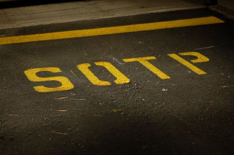 1971 Ford Ranchero - Yellow painted letters SOTP on asphalt with a yellow line.