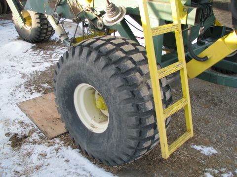 1982 Ford F-150 - Detail of a heavy-duty tire and access ladder on an agricultural machine.