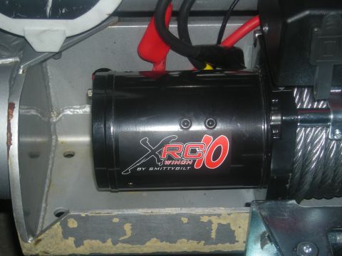 1991 Ford Bronco - Close-up of a Smittybilt XRC 10 winch, a common aftermarket off-road accessory.