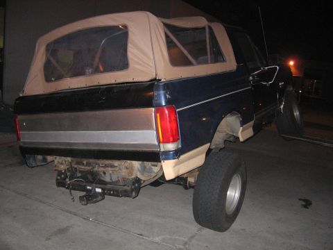 1989 Ford Bronco - This 1989 Ford Bronco features a two-tone paint scheme and a removable tan soft top.