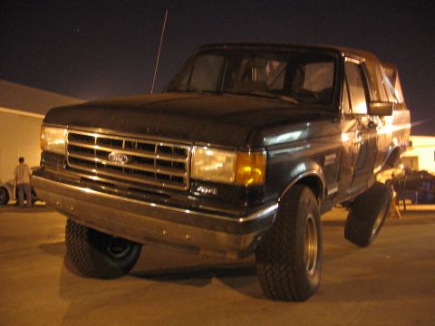 1989 Ford Bronco - This 1989 Ford Bronco is shown from the front-three-quarter view at night.