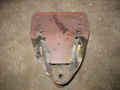 1995 Ford C-350 (Centurion Conversions) - A close-up view of a welded metal bracket, likely a vehicle part.