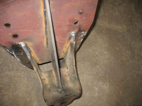 1995 Ford C-350 (Centurion Conversions) - Close-up of a metal bracket, likely a vehicle part, showing signs of rust and welding.