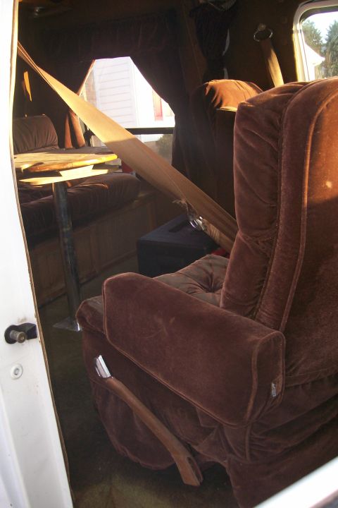 1982 Ford E350 - The interior of a van is visible, showing the seats and dashboard.