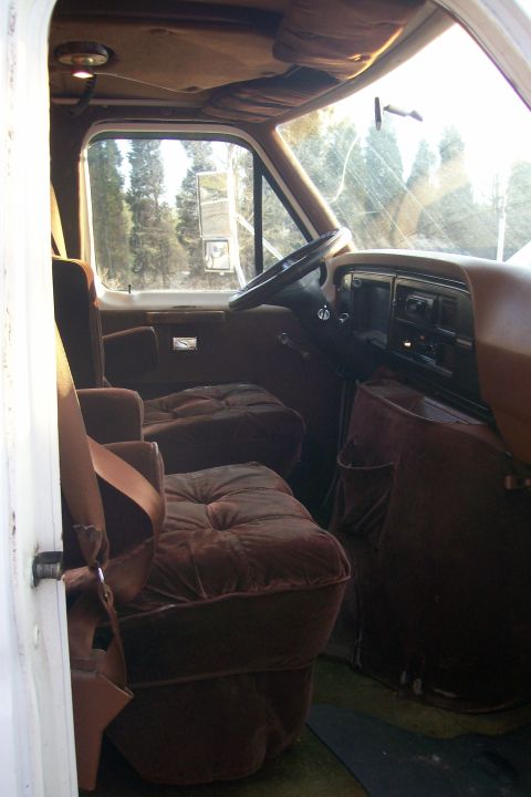 1982 Ford E350 - Interior view of a 1982 Ford E350 van, highlighting the captain's chairs and dashboard details.