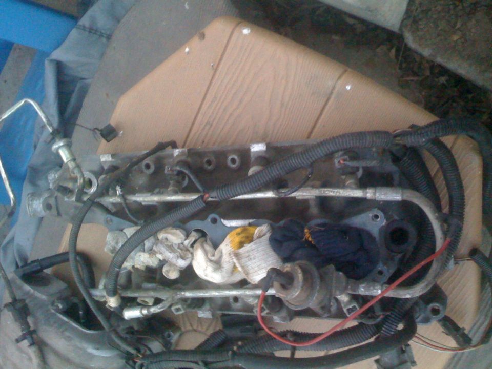 Fuel rail assembly with injectors and wiring harnesses from a 1983 Ford Bronco