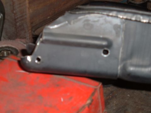1990 Ford Ranger - A close-up shot shows a metal part with two drilled holes, possibly from a 1990 Ford Ranger. The metal appears to have been recently worked…