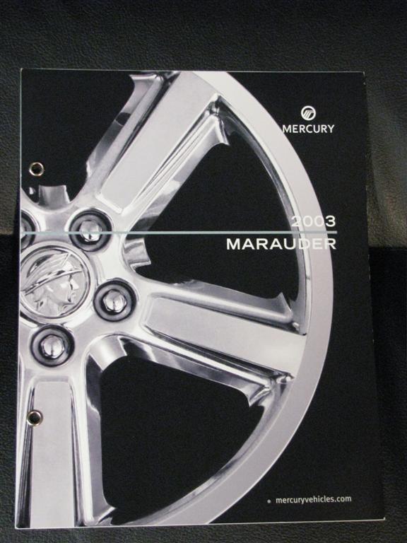 2003 Mercury Marauder brochure cover with a chrome five-spoke wheel