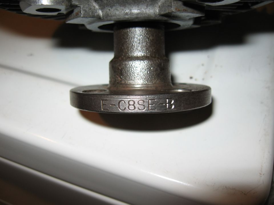 Metal flange with stamped text E-C8SE-B