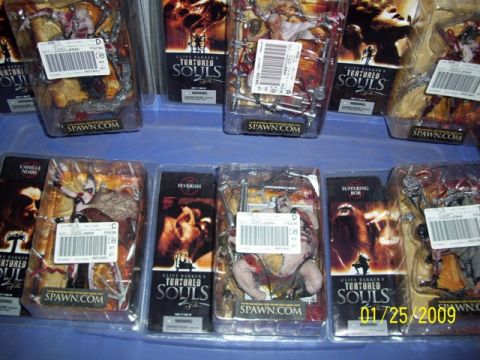 1991 Ford Bronco - Several Clive Barker's Tortured Souls action figures are displayed in their packaging, with a date stamp of 01/25/2009 visible.