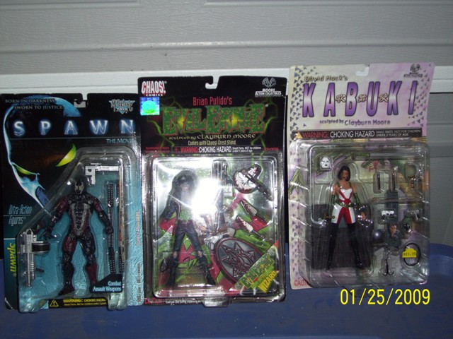 Three boxed action figures: Spawn, Brian Pulido's Lady Death, and Kabuki