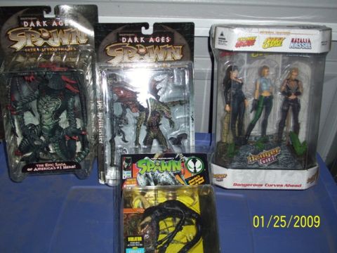1991 Ford Bronco - Packaged Spawn and Danger Girl action figures displayed on a blue surface.