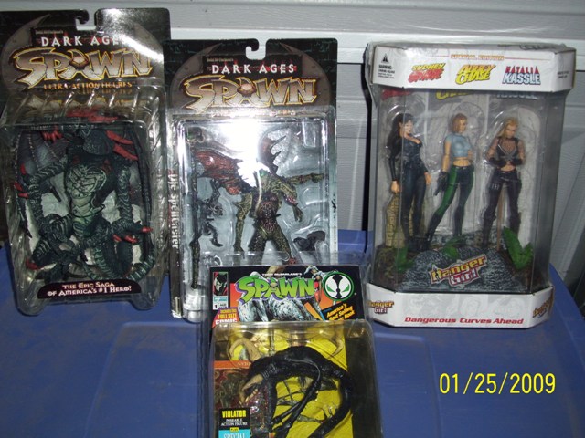 Collection of packaged Spawn and Danger Girl action figures