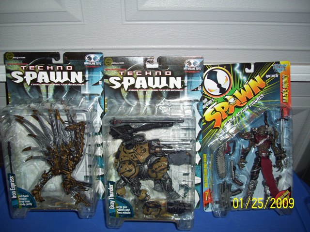 Three Spawn action figures in packaging: Techno Spawn, Techno Spawn, and Zombie Spawn.
