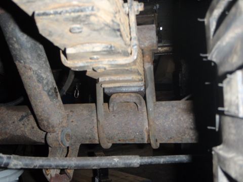 1996 Ford Bronco - This is a close-up view of the rear suspension of a 1996 Ford Bronco, focusing on the leaf spring and U-bolt assembly connecting to the axl…