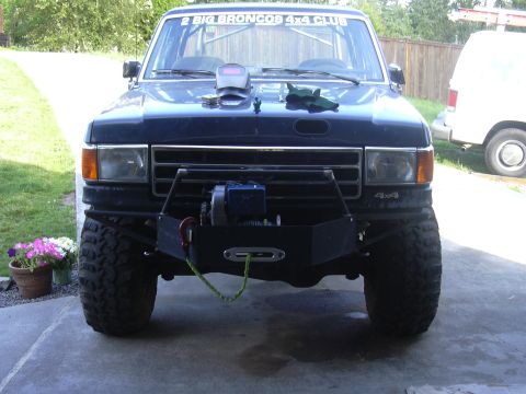 1991 Ford Bronco - Front view of a 1991 Ford Bronco, modified with a winch and a welding mask on the hood.