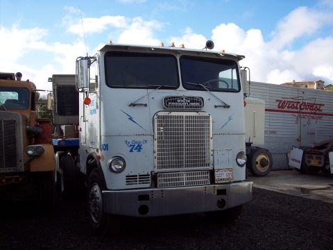 1981 Kenworth W900A - This white semi-truck features "The Class of '74" painted on its side, along with blue lightning bolt graphics.