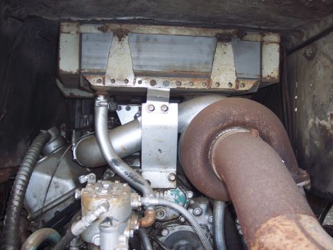 1981 Kenworth W900A - Close-up view of a truck's engine compartment, highlighting a large turbocharger and various pipes.