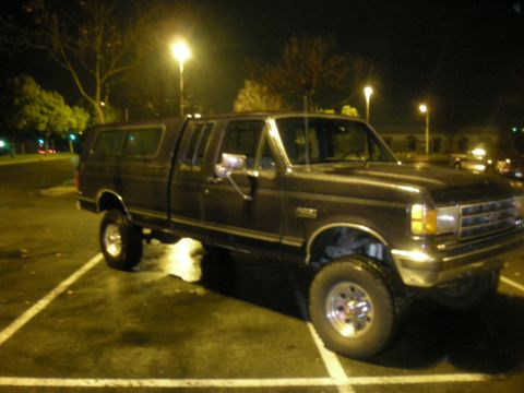 1991 Ford Bronco - This Ford F-Series truck, likely from the early 1990s, is equipped with a camper shell.