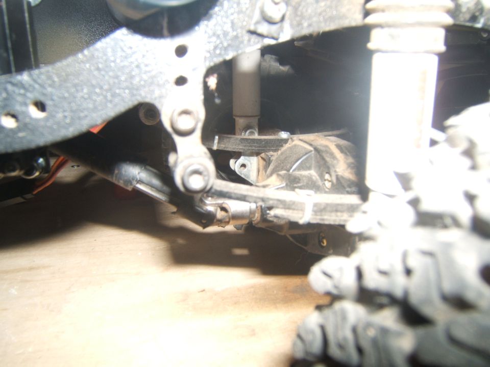 RC crawler suspension components including shocks, linkage, and differential housing