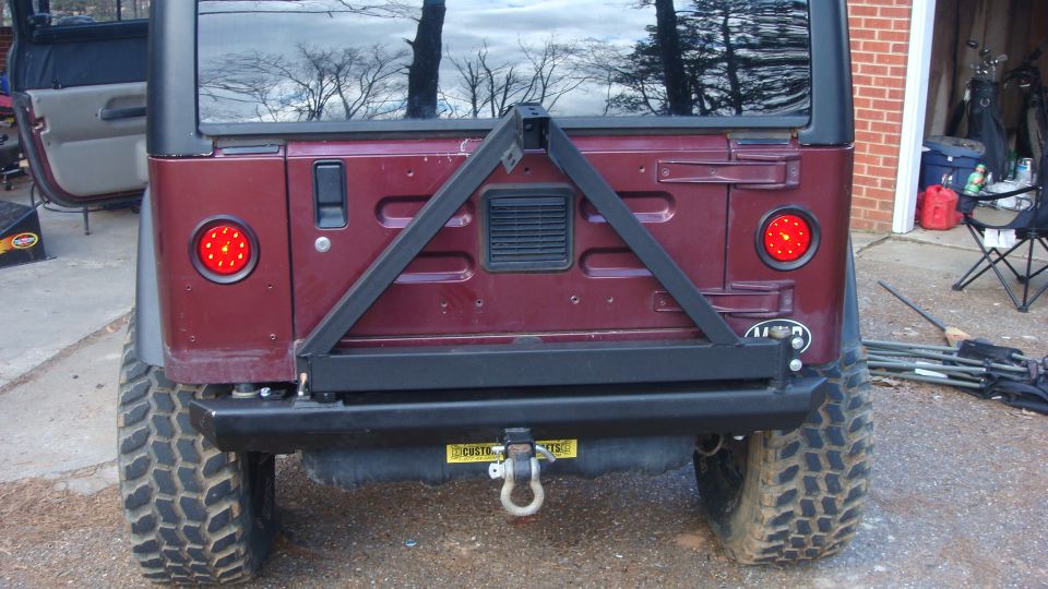 Maroon Jeep Wrangler rear with spare tire carrier and LED tail lights