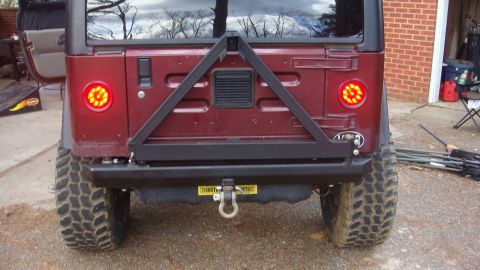 1995 Ford Bronco - This Jeep Wrangler features custom LED tail lights and a heavy-duty spare tire mount on the rear.