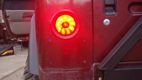 1995 Ford Bronco - This photo shows a close-up of a red vehicle's rear LED tail light assembly.