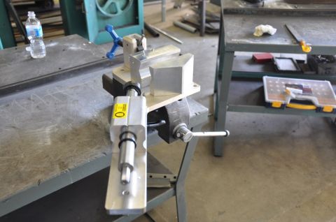 1996 Ford Bronco - A machining vise is used to hold a metal component in place for processing.