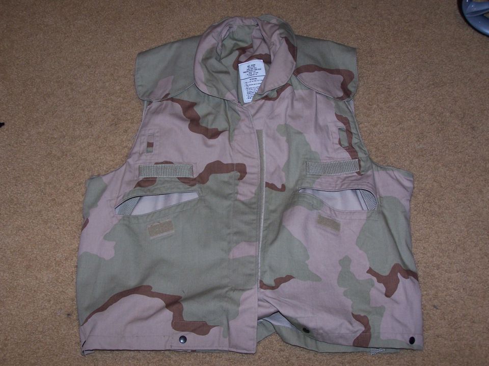 Camouflage vest on brown carpet