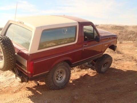 1992 Ford Bronco - This Ford Bronco is shown off-road in a desert-like environment.
