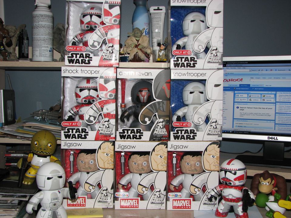 Star Wars and Marvel action figures and a computer monitor