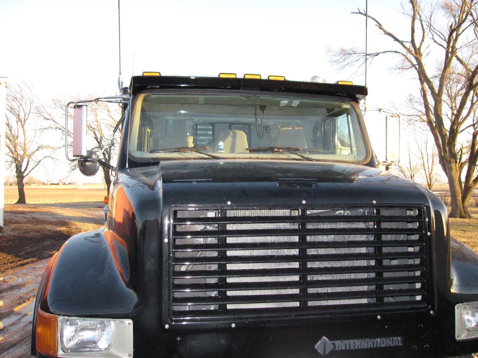 Photo of the front grille and windshield of a black International truck