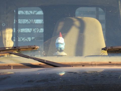 1992 Ford Bronco - Photograph of a gnome on a truck dashboard, not a technical document.