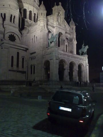 1991 Ford LTD Crown Victoria - Nighttime photograph of a vehicle before the Sacre-Coeur basilica, not a technical document.