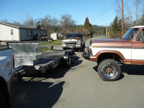 1991 Ford Bronco - A copper-brown and white late-1970s Ford F-150 4x4 pickup with faded paint sits at right on white-letter Bandit LT tires and chrome-slotted…