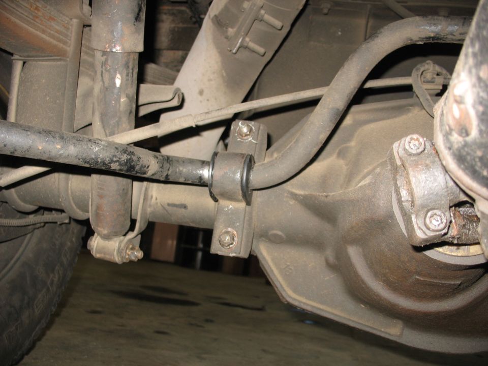 Rear suspension of a Ford C-350 showing sway bar, shock, and differential.