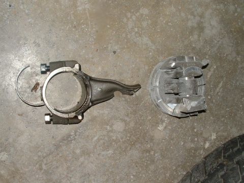 1978 Ford Ranchero - A damaged connecting rod and piston are shown lying on a concrete surface.