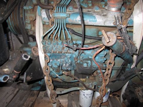 1992 Ford Bronco - Close-up photograph of a diesel injection pump and fuel lines on an engine, not a document.