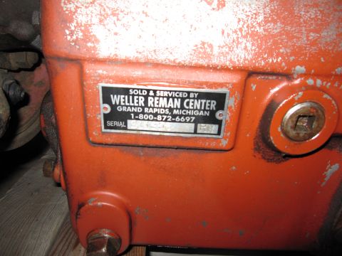 1992 Ford Bronco - Riveted metal serial/data plate from Weller Reman Center, Grand Rapids, Michigan, with a serial number field.