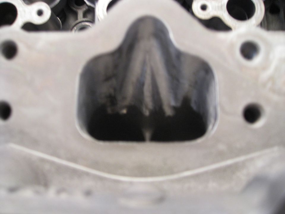 Silver engine cylinder head intake port with sculpted interior