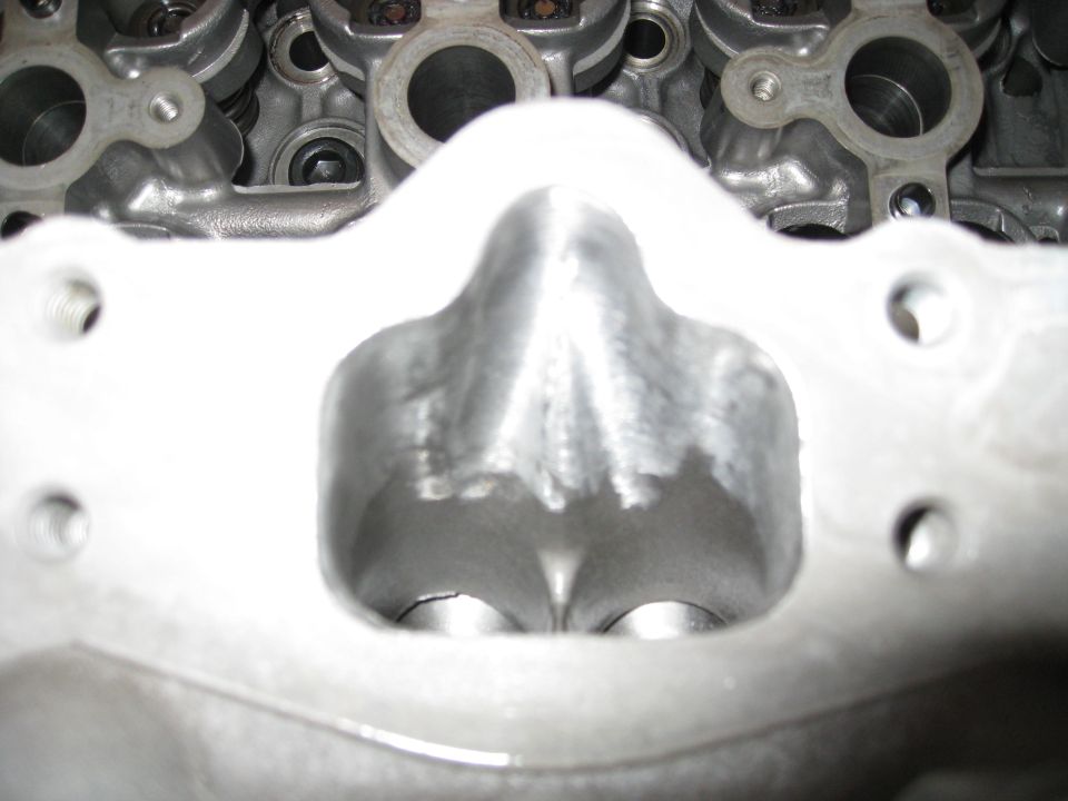 Engine cylinder head intake ports, polished and modified.