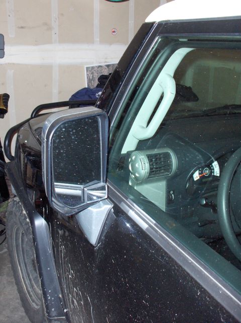 2008 Toyota FJ Cruiser - The distinctive front end and side profile of a black 2008 Toyota FJ Cruiser are visible in this image.