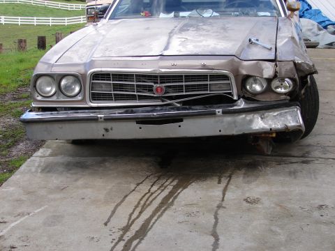 1973 Ford Ranchero - The front of a damaged 1973 Ford Ranchero shows significant collision impact on the right side.