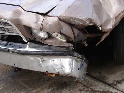 1973 Ford Ranchero - The front end of a 1973 Ford Ranchero shows significant damage, including a crumpled grille and bumper.