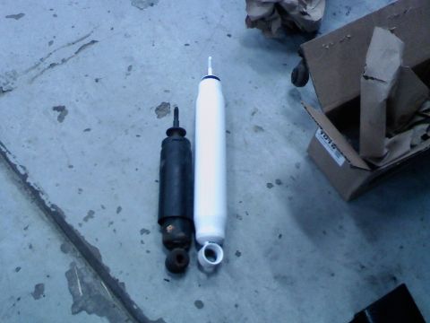 1986 Ford Bronco - old stock shock next to new lifted length shock. these were wooped and I wouldn't be suprised if these were original 1986 shocks.