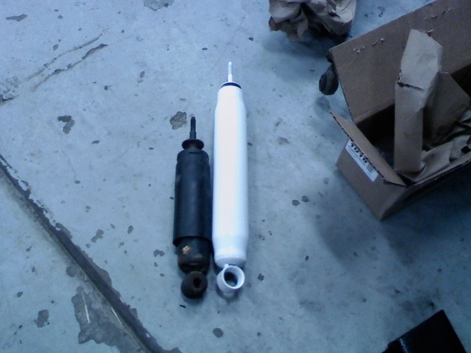 old stock shock next to new lifted length shock. these were wooped and I wouldn't be suprised if these were original 1986 shocks.