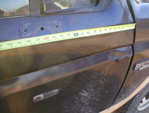1983 Ford Bronco - The rear screw hole is exactly 18 3/4" from the front edge of the door, so mark a vertical line coming up from the body line.
