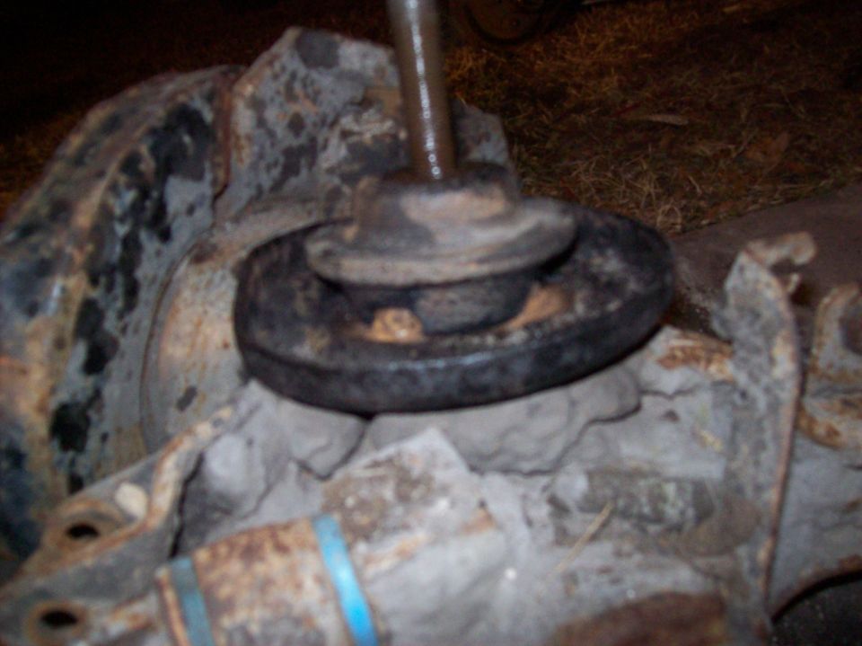 Close-up of rusted vintage vehicle suspension part, possibly shock mount.